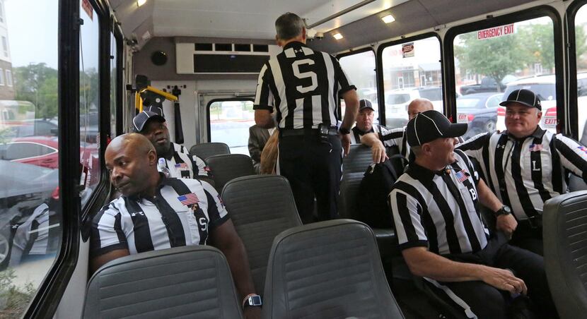 The SEC officiating crew boards the bus to go to the stadium before the  Louisiana Lafayette...