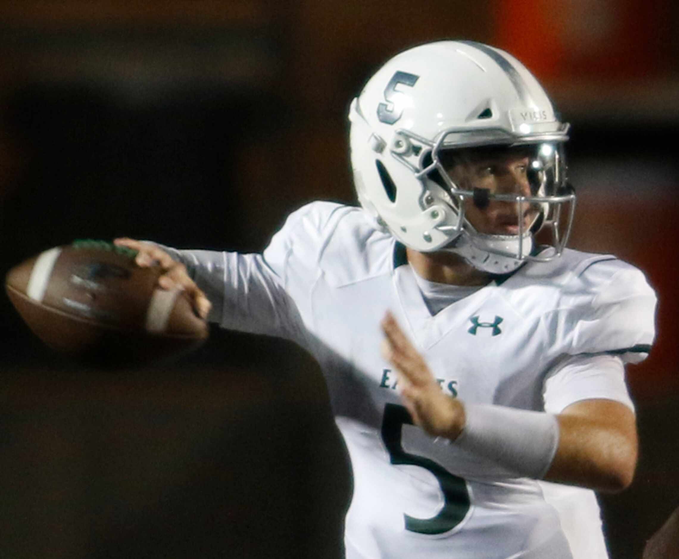 Prosper quarterback Jackson Berry (5) prepares to launch a pass downfield during first half...