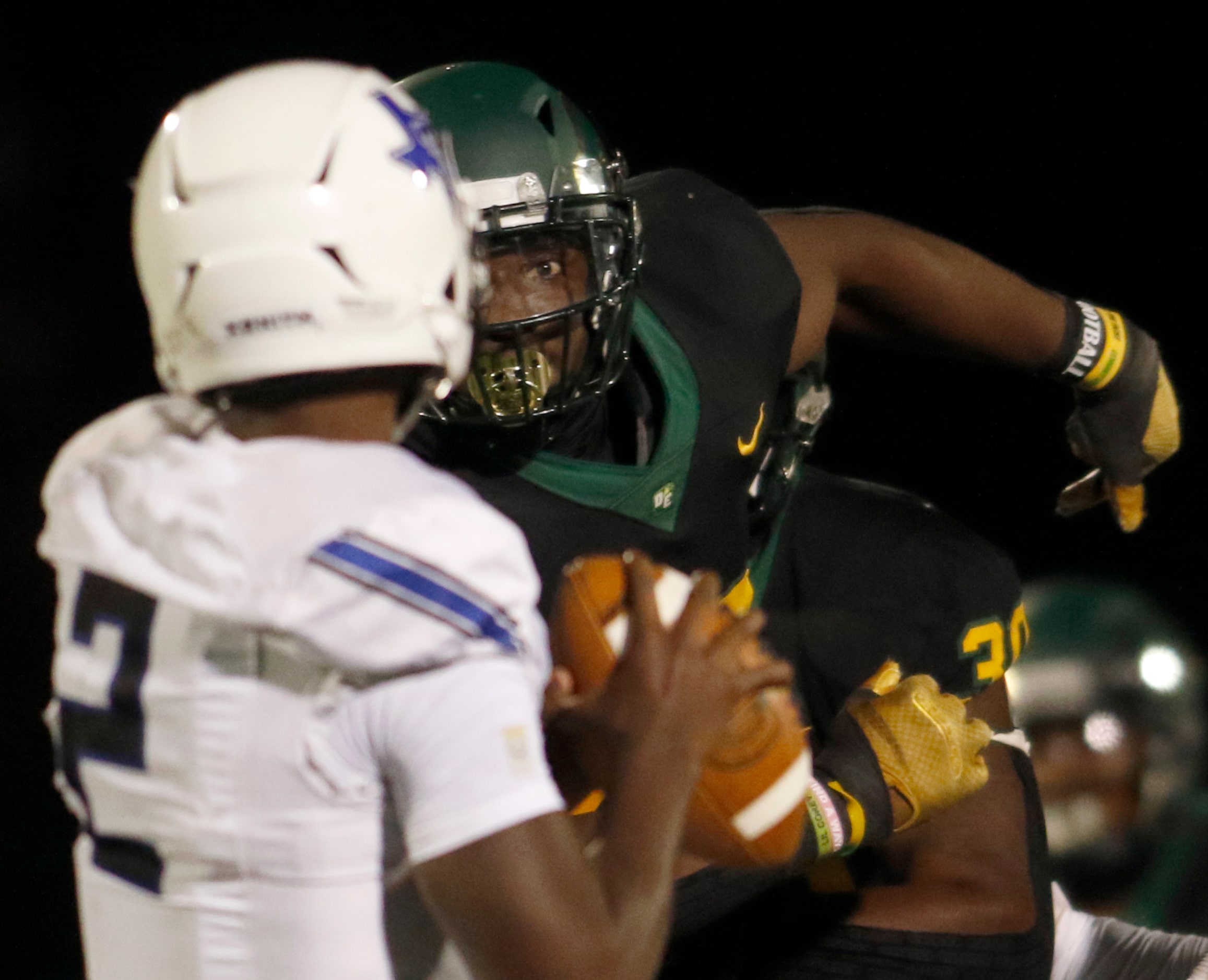 DeSoto Eagles defensive lineman Shemar Turner (32) pressures Trinity Christian - Cedar Hill...