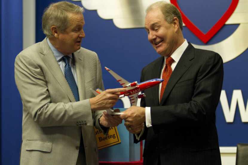 Boeing president Jim Albaugh presented Southwest CEO Gary Kelly a model of the Boeing 737...