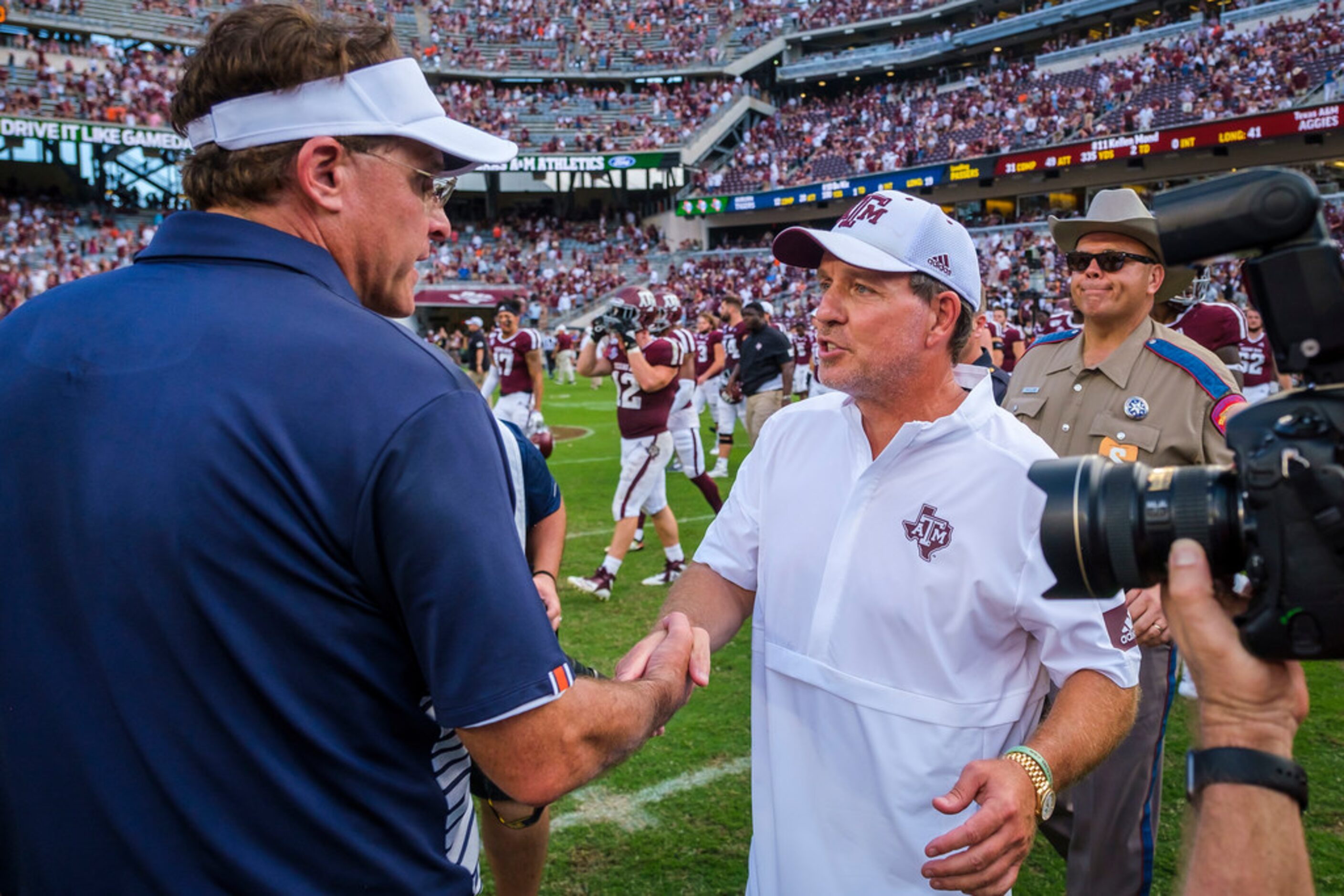 Texas A&M head coach Jimbo Fisher shakes hands with Auburn head coach Gus Malzahn after an...