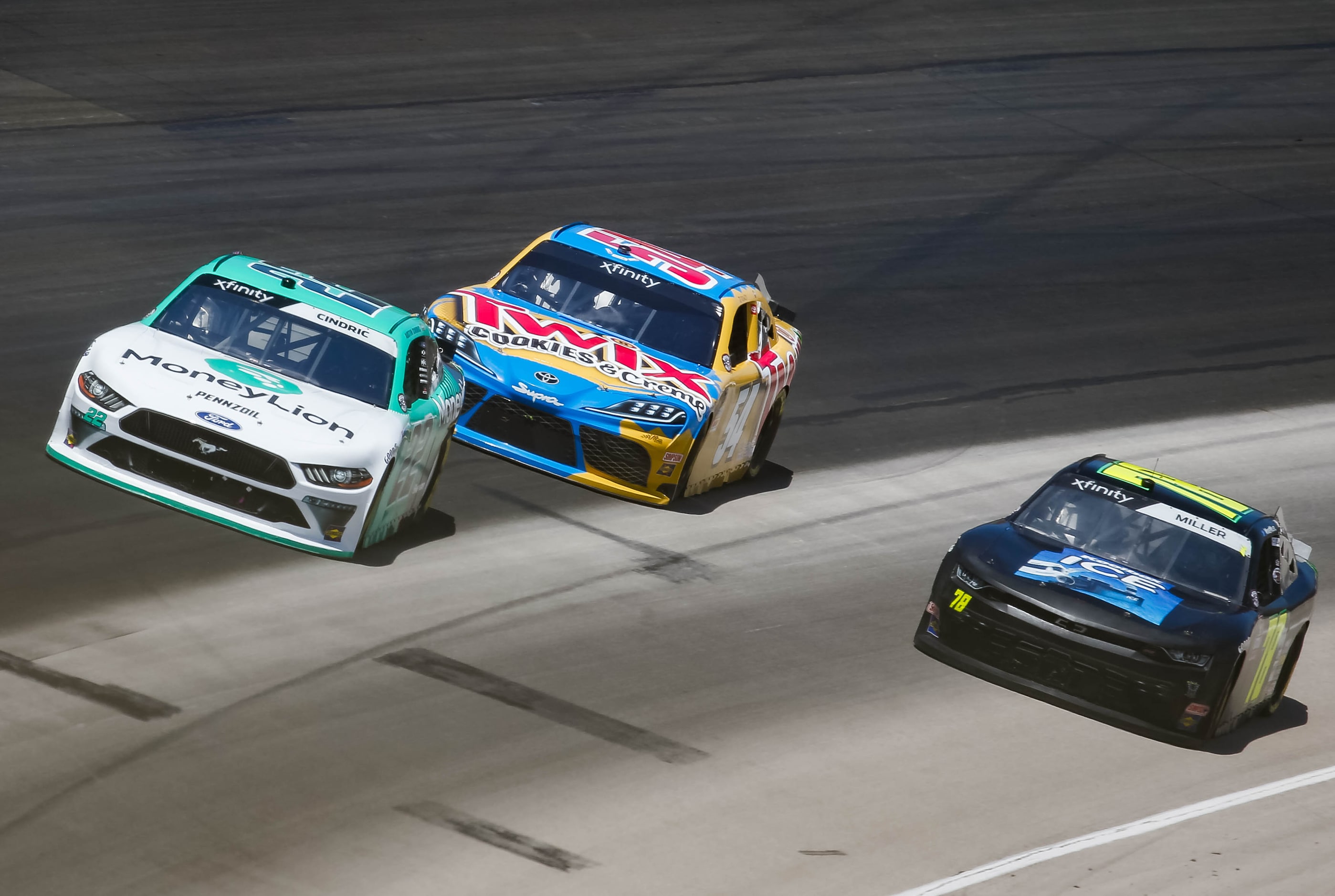 NASCAR Xfinity's Austin Cindric (No. 22) races in front of Kyle BuschÕs (No. 54) down the...