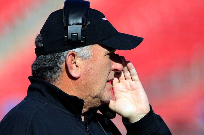 SMU head coach June Jones yells instructions to his quarterback during the fourth quarter of...