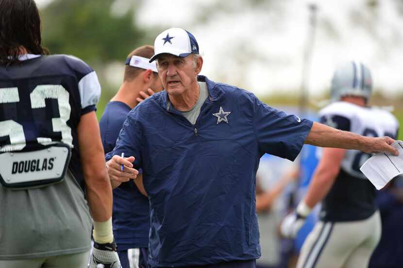 Assistant head coach /defense Monte Kiffin talks to Dallas Cowboys outside linebacker...