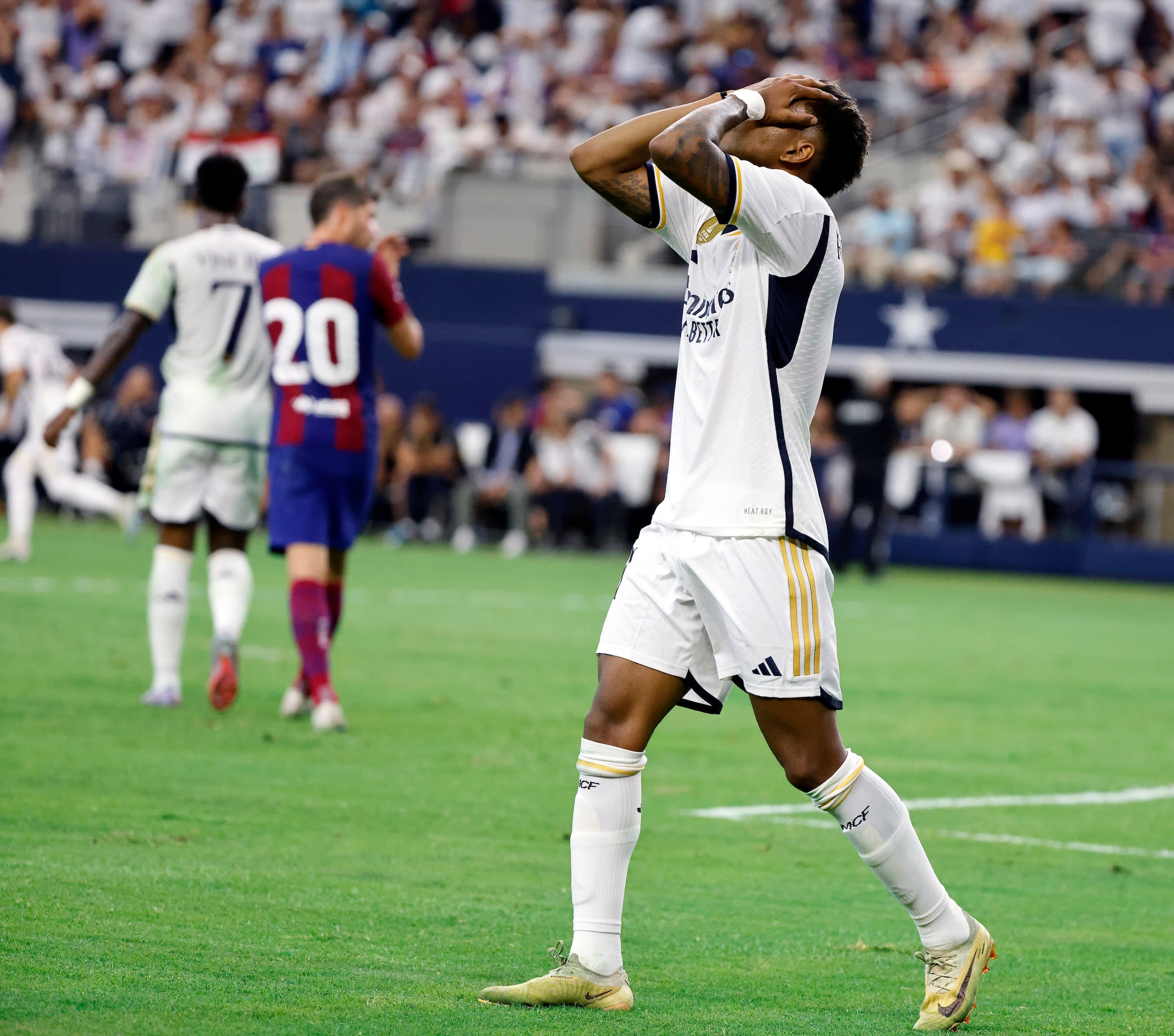 Real Madrid’s Rodrygo Silva (11) reacts after letting the ball creep out of bounds near the...