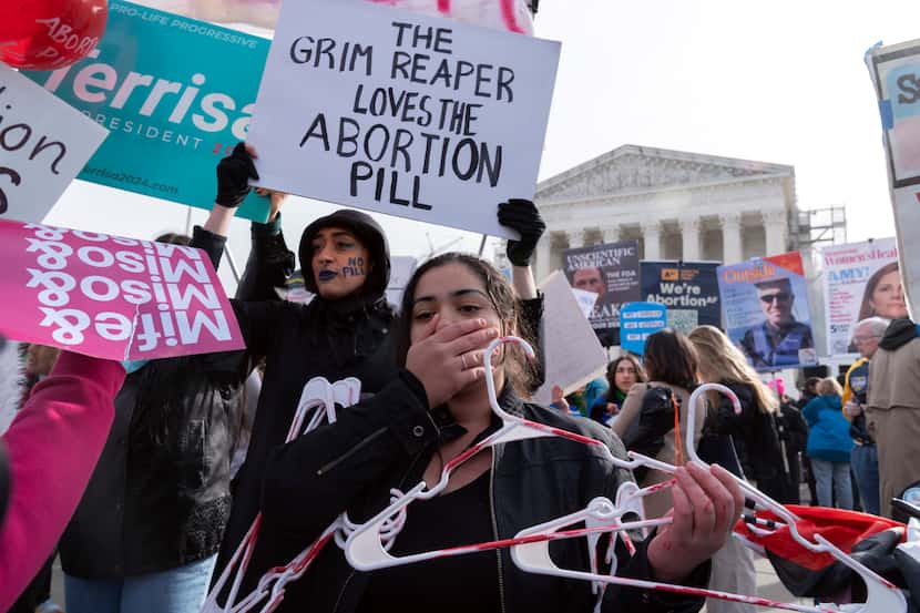 Abortion-rights activists and anti-abortion demonstrators rally outside of the Supreme...