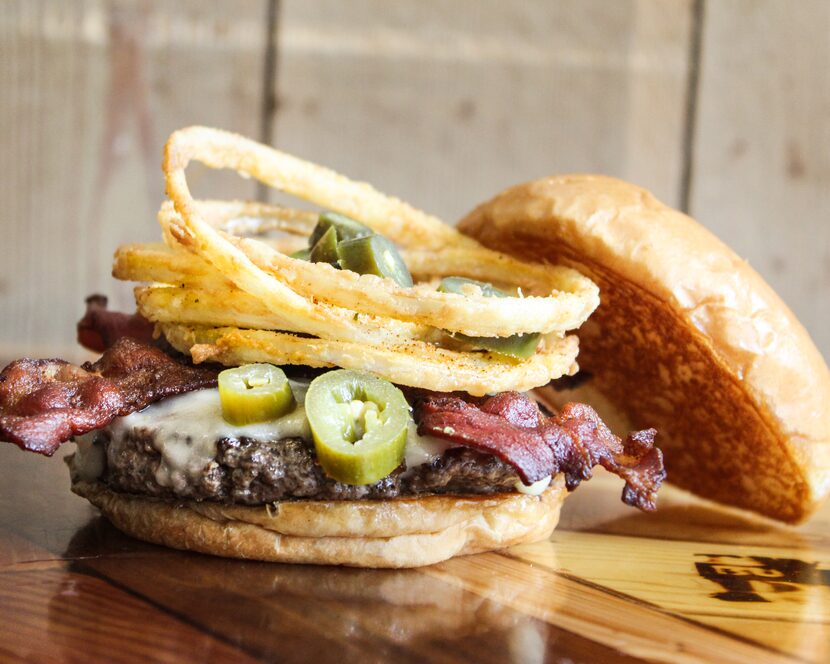 One of the burgers at Twisted Root is the Western: pepper jack, bacon, fried onion strings...