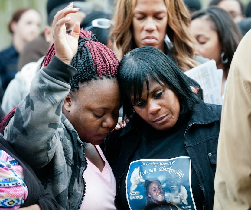 Rosetta Taylor hugs Sheila Blankenship, mother of Da'Coreyan Blankenship, during the...