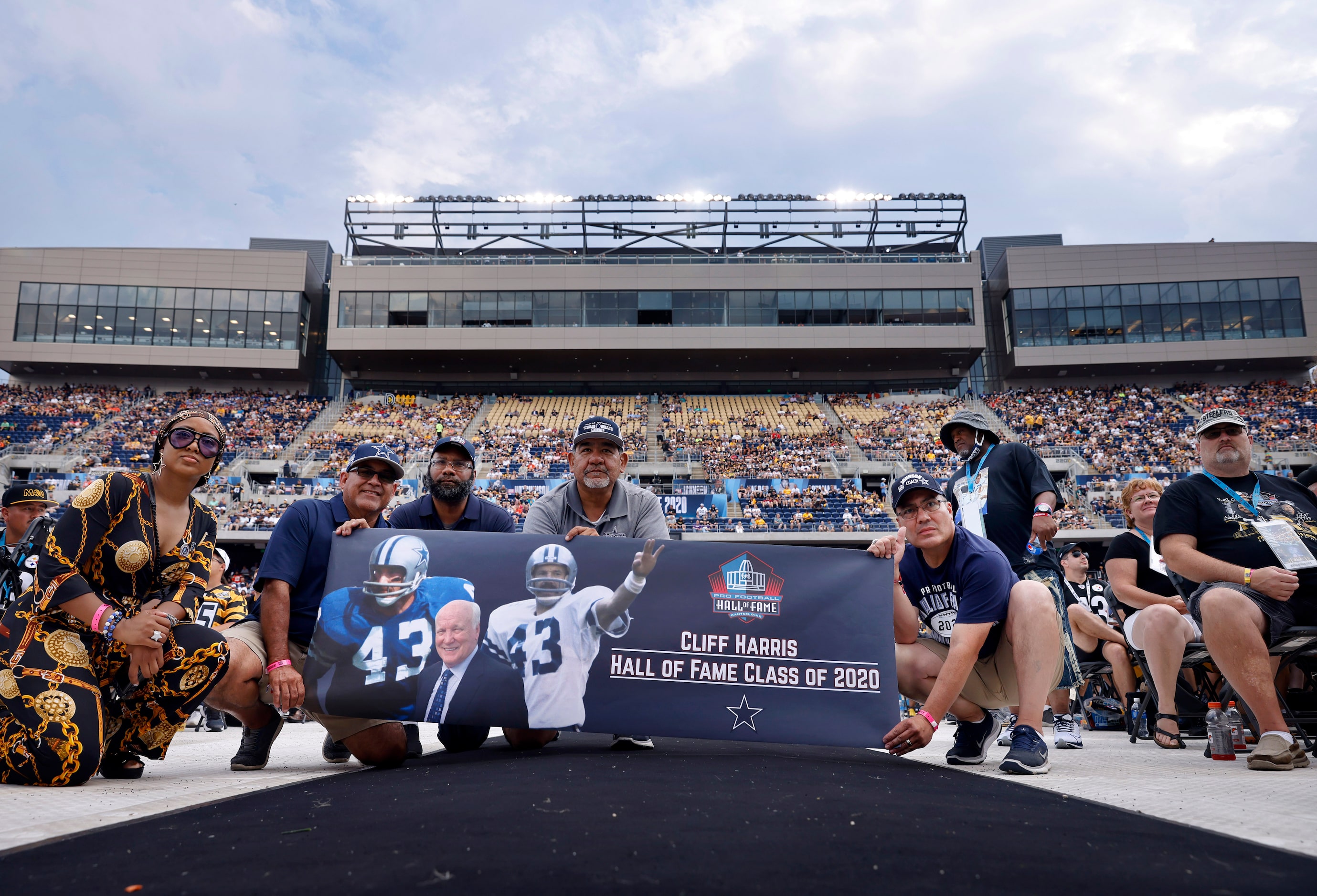 Dallas Cowboys fans display a banner of Pro Football Hall of Fame inductee Cliff Harris of...