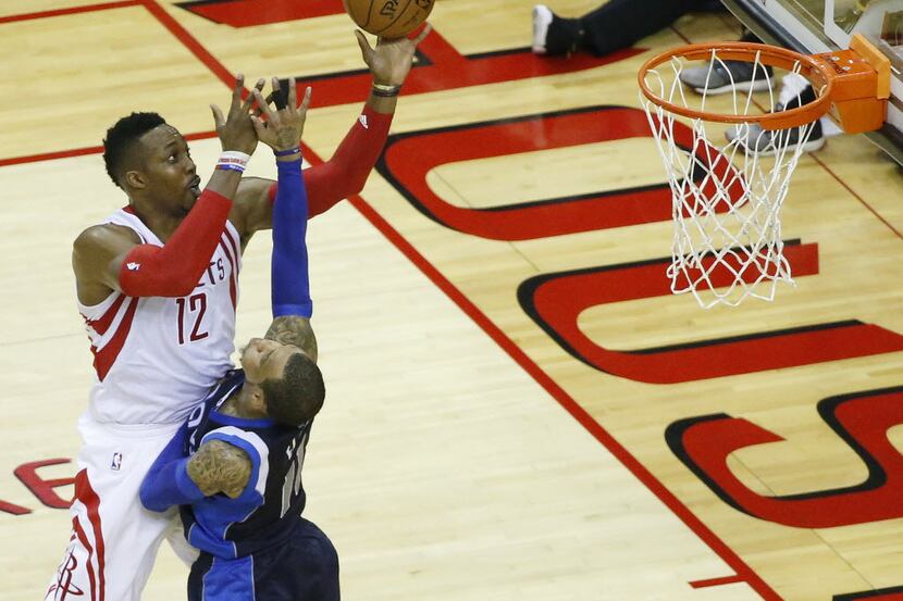 Houston Rockets center Dwight Howard (12) shoots the ball over Dallas Mavericks guard Monta...