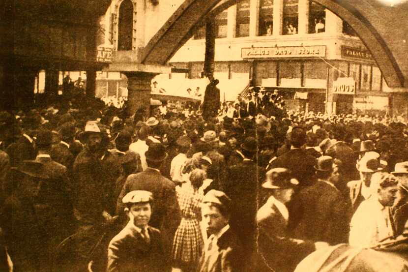 Close-up view of a postcard that depicts a public lynching in Dallas. In this photo, taken...