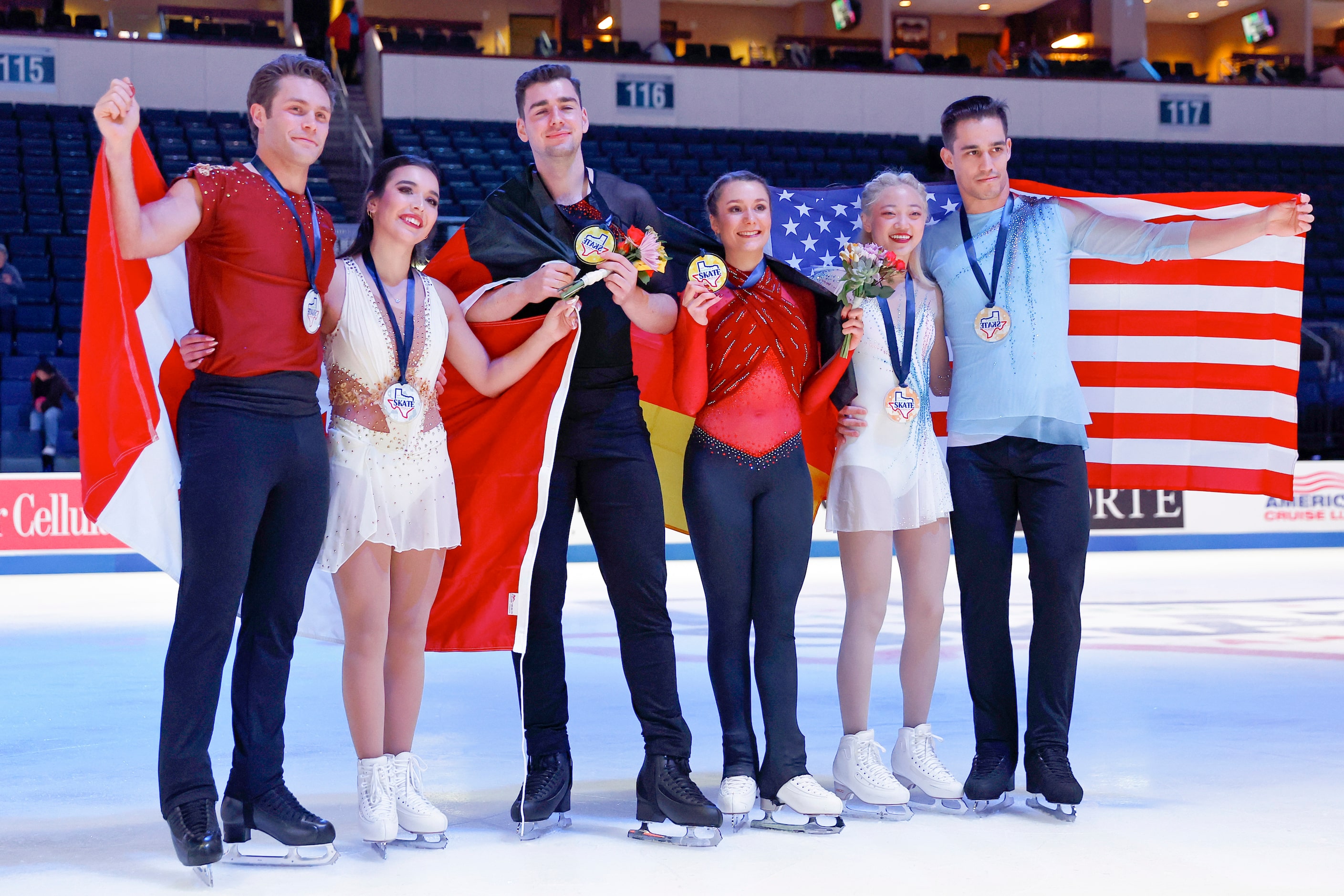 Annika Hocke and Robert Kunkel, of Germany, center, pose for photos after winning the gold...