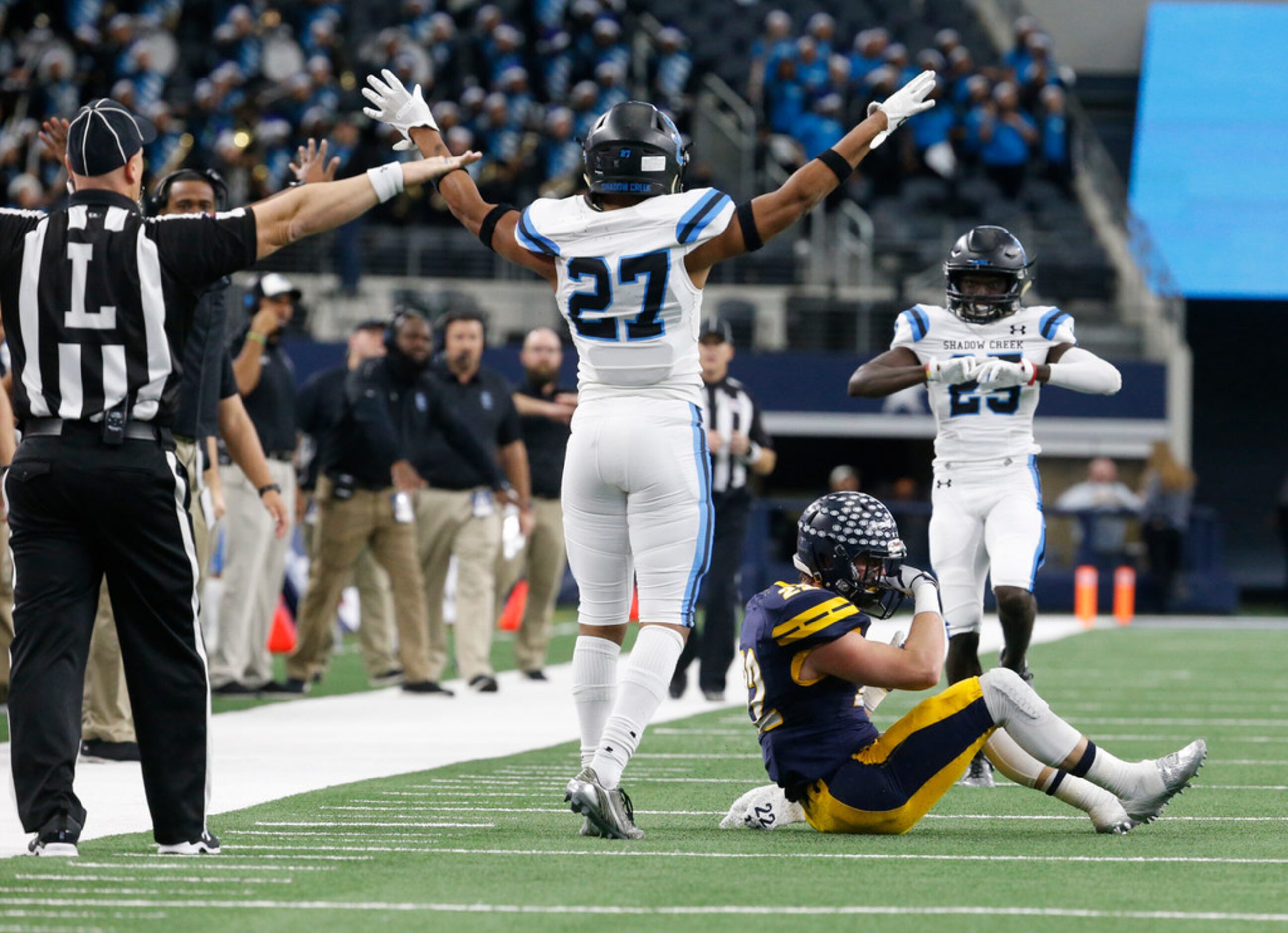 Shadow Creek's T.J. Marshall (27) celebrates breaking up a pass to Benner Page (22) during...