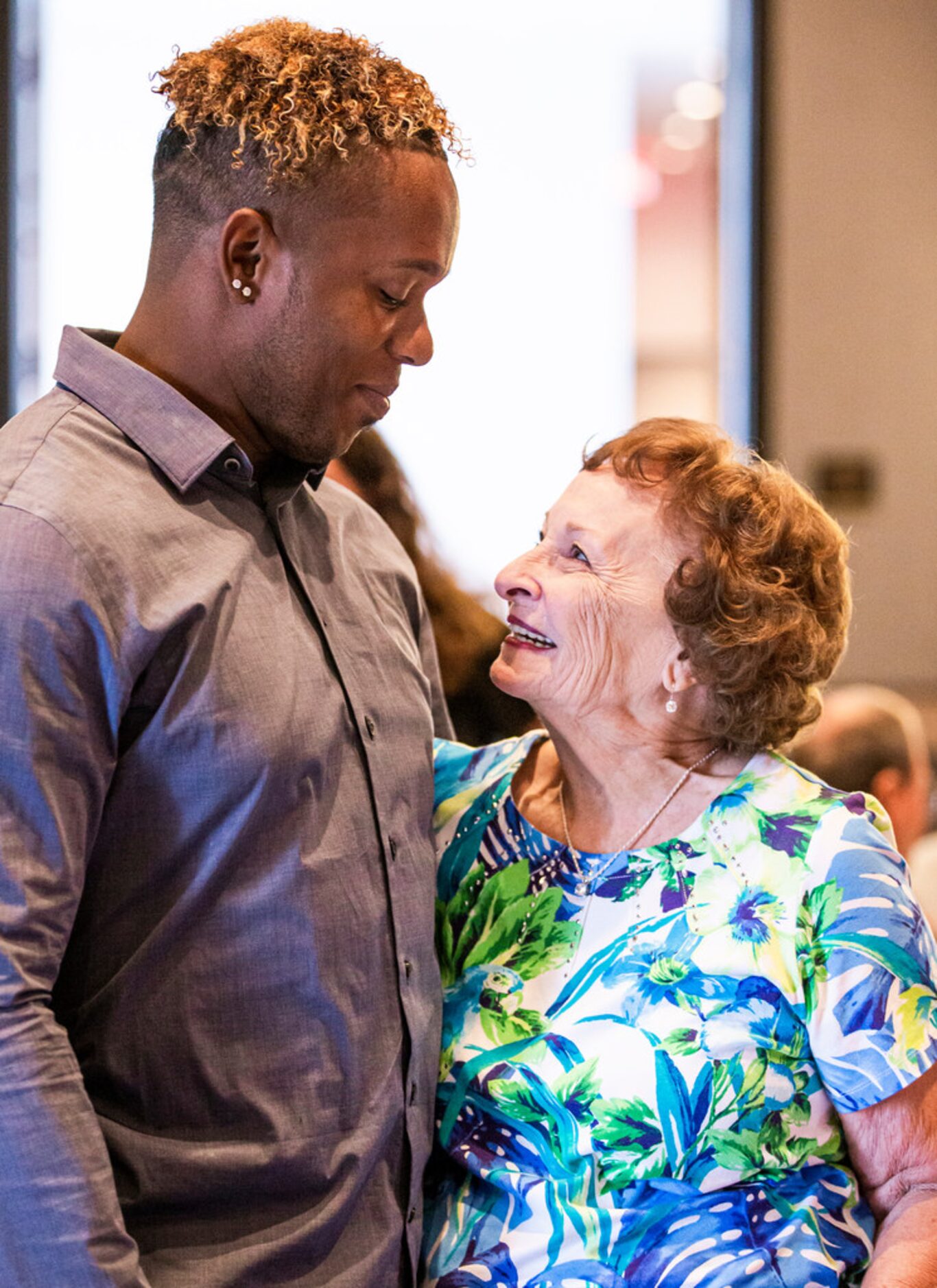 Season ticket holder Shirley Kost visits with former Texas Rangers pitcher Neftalâ Feliz...