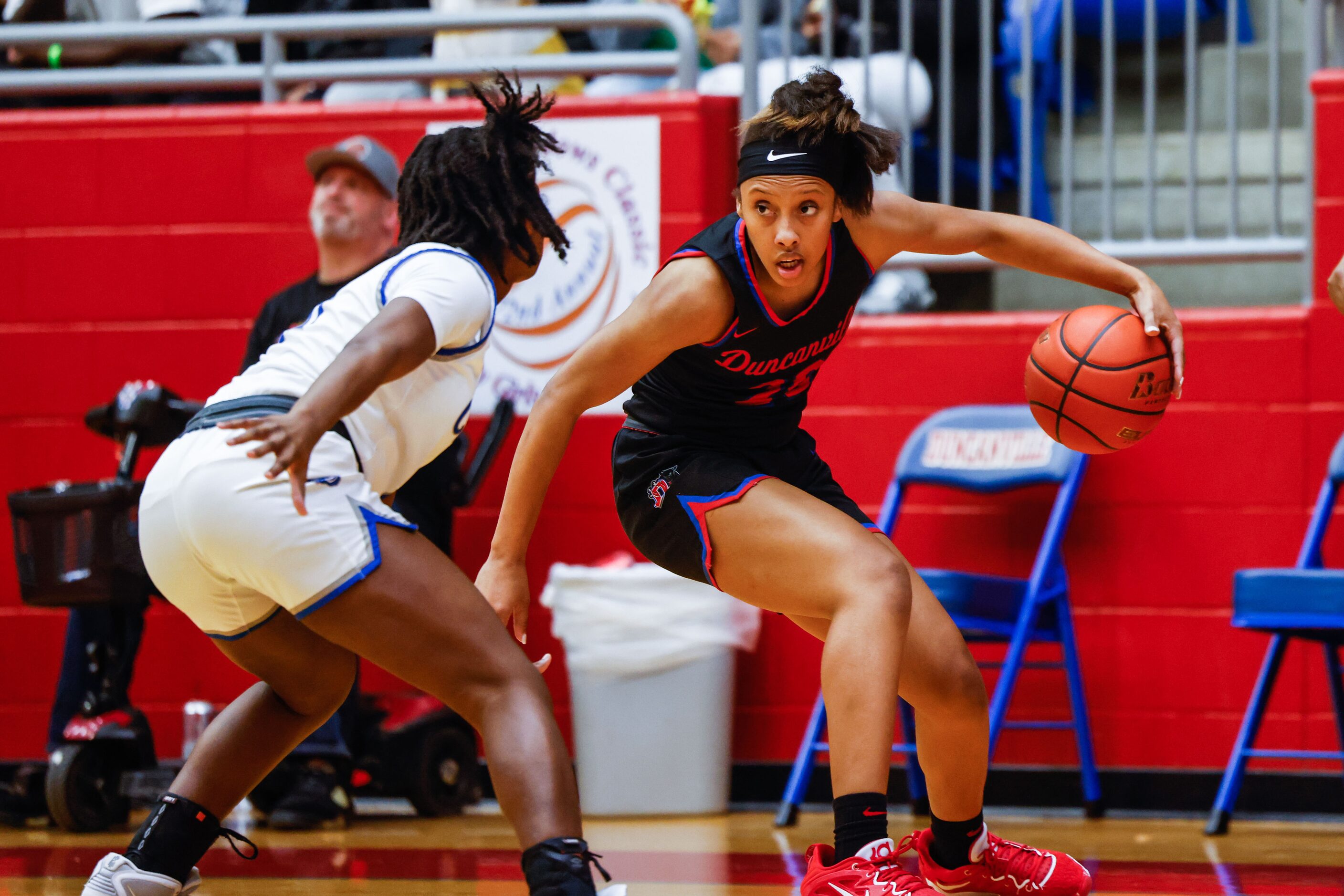 Duncanville Pantherettes' Jasmine Gipson (20) dribbles the basketball against Conway Lady...