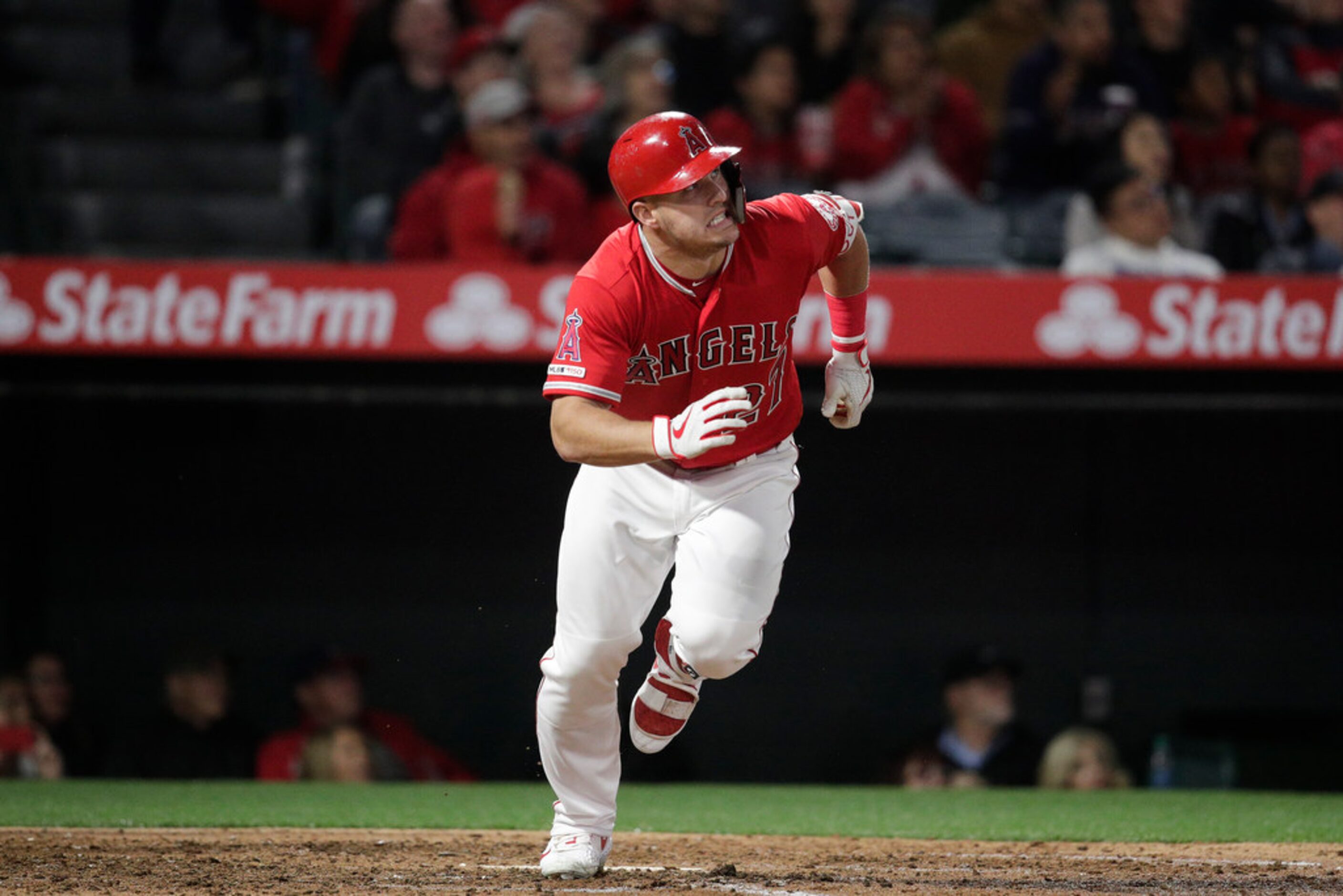 Los Angeles Angels' Mike Trout watches the flight of his home run during the sixth inning of...