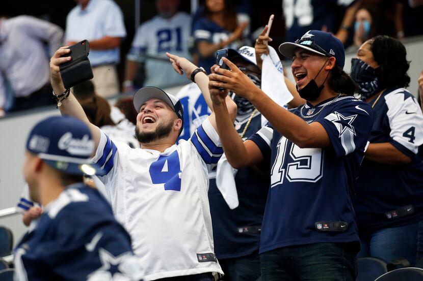 Cowboys fans celebrate after Cowboys kicker Greg Zuerlein (2) kicks the winning field goal...