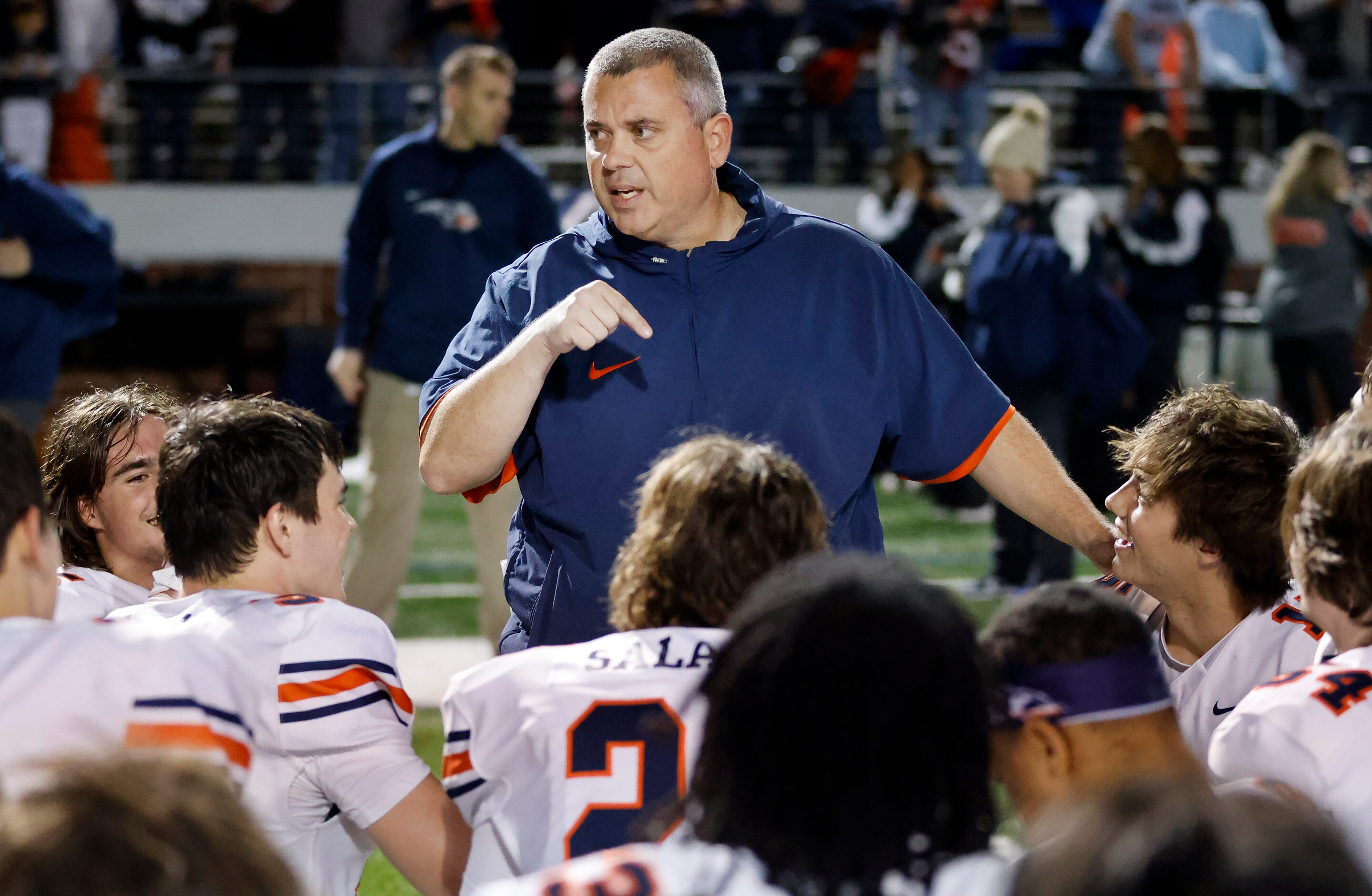 Frisco Wakeland head coach Chandler Isom speaks to his players following their Class 5A...