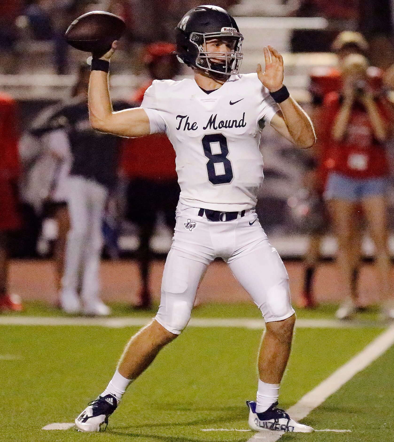 Flower Mound High School quarterback Yale Erdman (8) throws a touchdown pass during the...