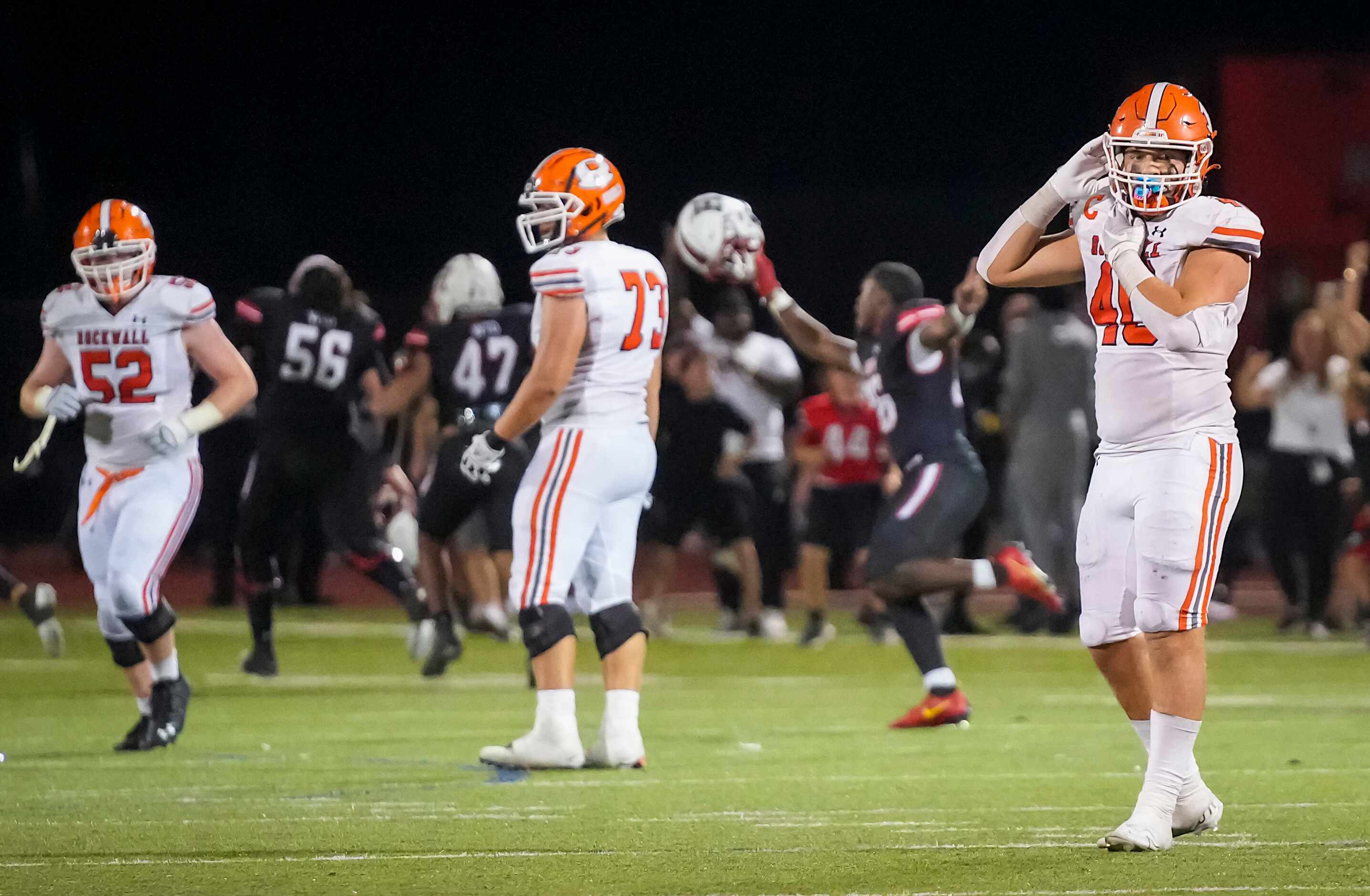 Rockwall tight end  Brennan Ray (40) looks away as Rockwall-Heath players celebrate after...