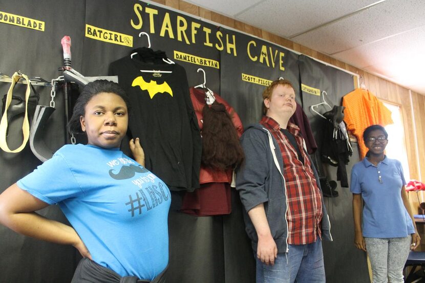 
Shatequa Driver (left), John David Kinneman and Alandria Rivera stand by the costumes they...