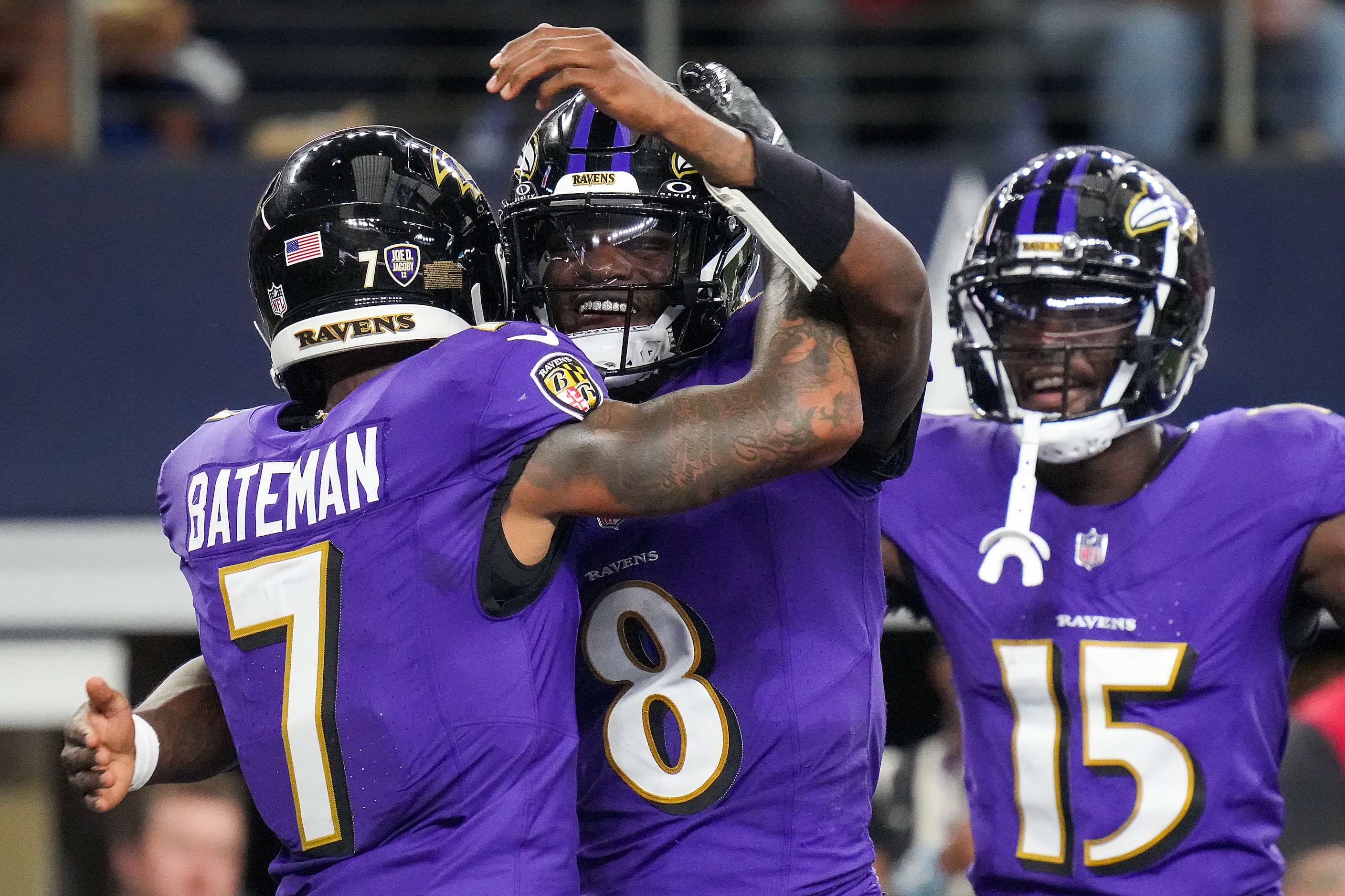 Baltimore Ravens quarterback Lamar Jackson (8) celebrates with wide receiver Rashod Bateman...