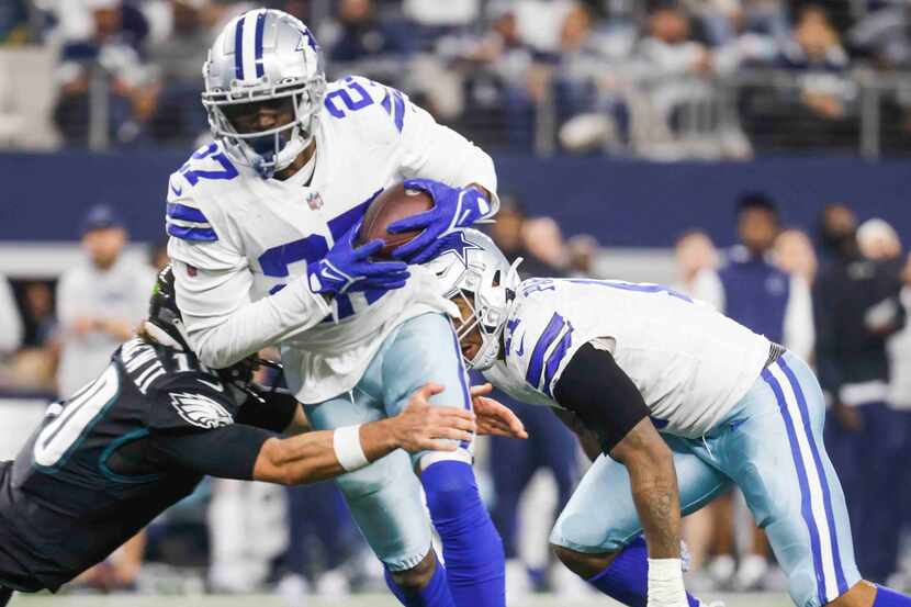 Dallas Cowboys safety Jayron Kearse (27) gets tackled by Philadelphia Eagles quarterback...