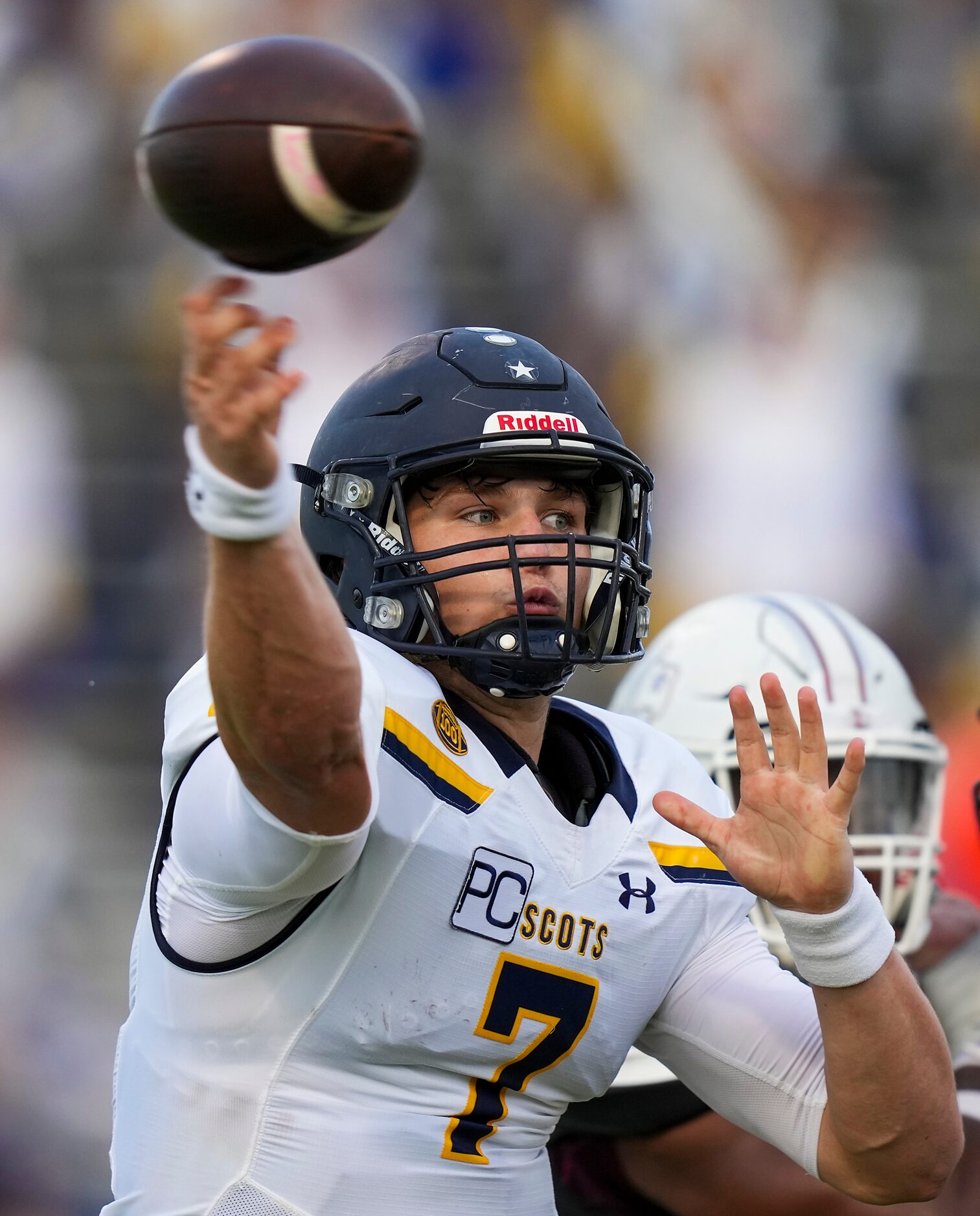 Highland Park quarterback  Brennan Storer (7) throws a pass during the first half of a high...