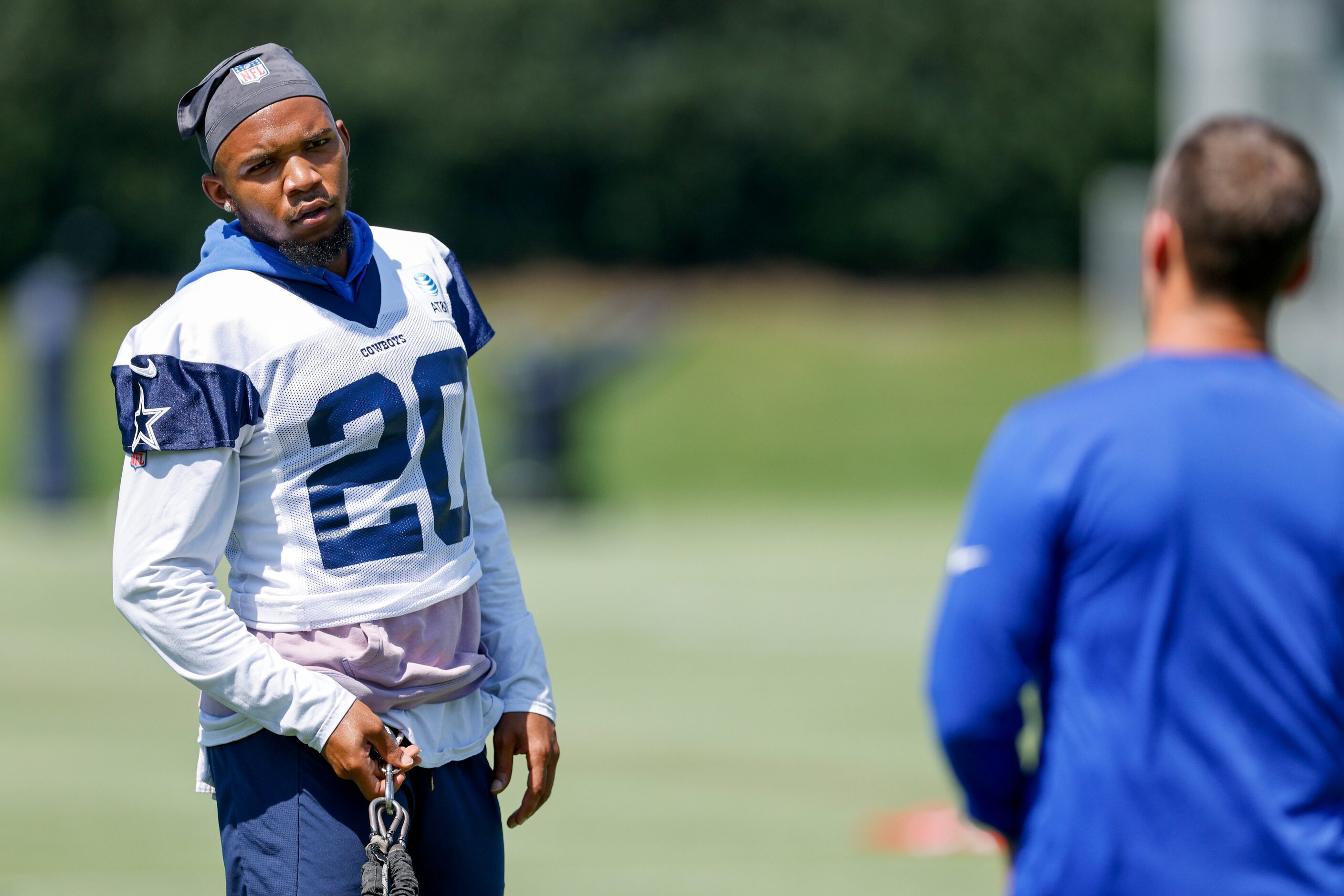 Dallas Cowboys running back Tony Pollard (20) works with a trainer during a practice at The...