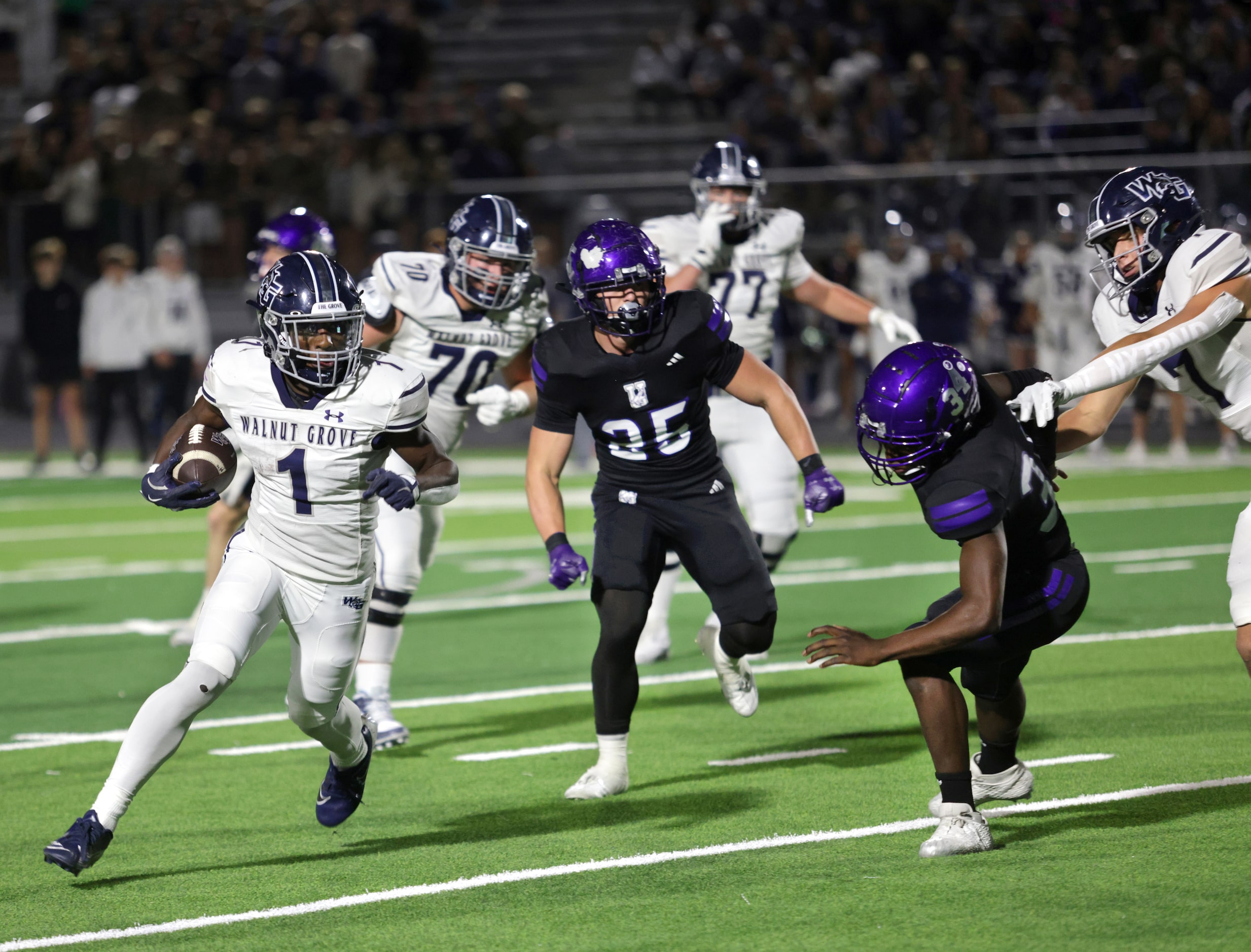 Walnut Grove player #1 Cam Newton slips by the defense for a gain during the Prosper Walnut...