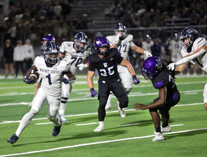 Walnut Grove player #1 Cam Newton slips by the defense for a gain during the Prosper Walnut...