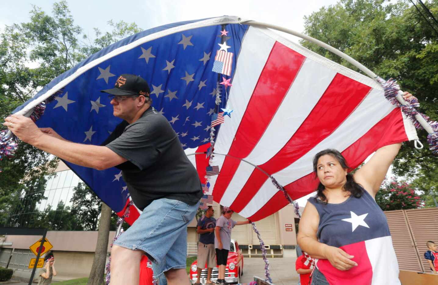 Fred Webb, left, and Selena Hernandez, work on a float for the Irving Boys Football...