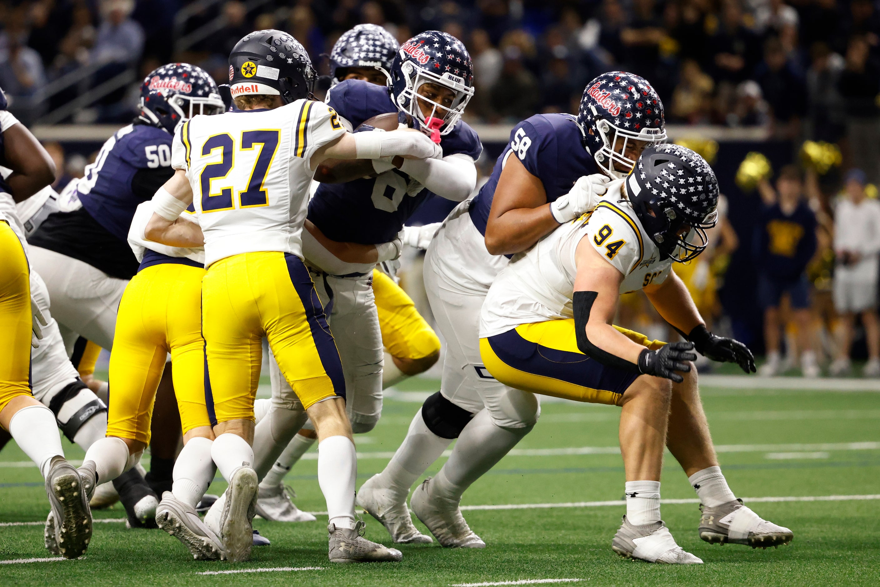 Highland Park defensive back Ronan Moreland (27) tackles Denton Ryan running back Nemo...