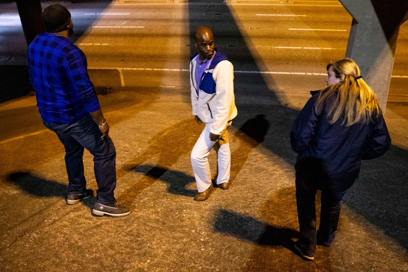 Ben Bailey, left, search for homeless people along with his coworkers at Metrocare Ikenna...