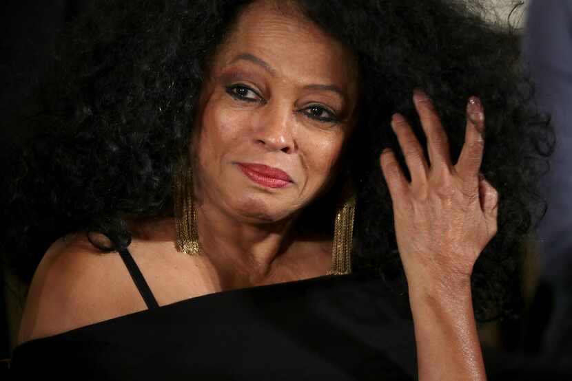 Popular music icon Diana Ross listens to President Barack Obama before being awarded the...