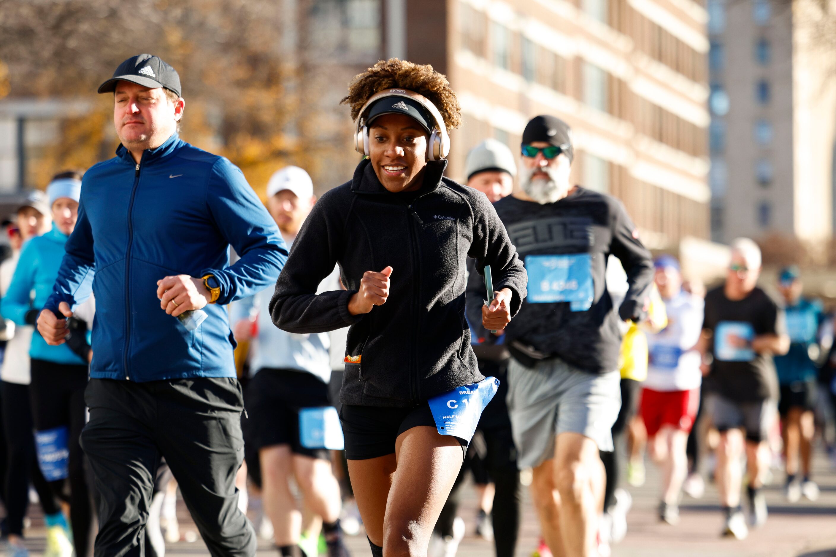 Runners goes along Young St. during 2023 BMW Dallas Marathon on, Sunday, Dec. 10, 2023, in...