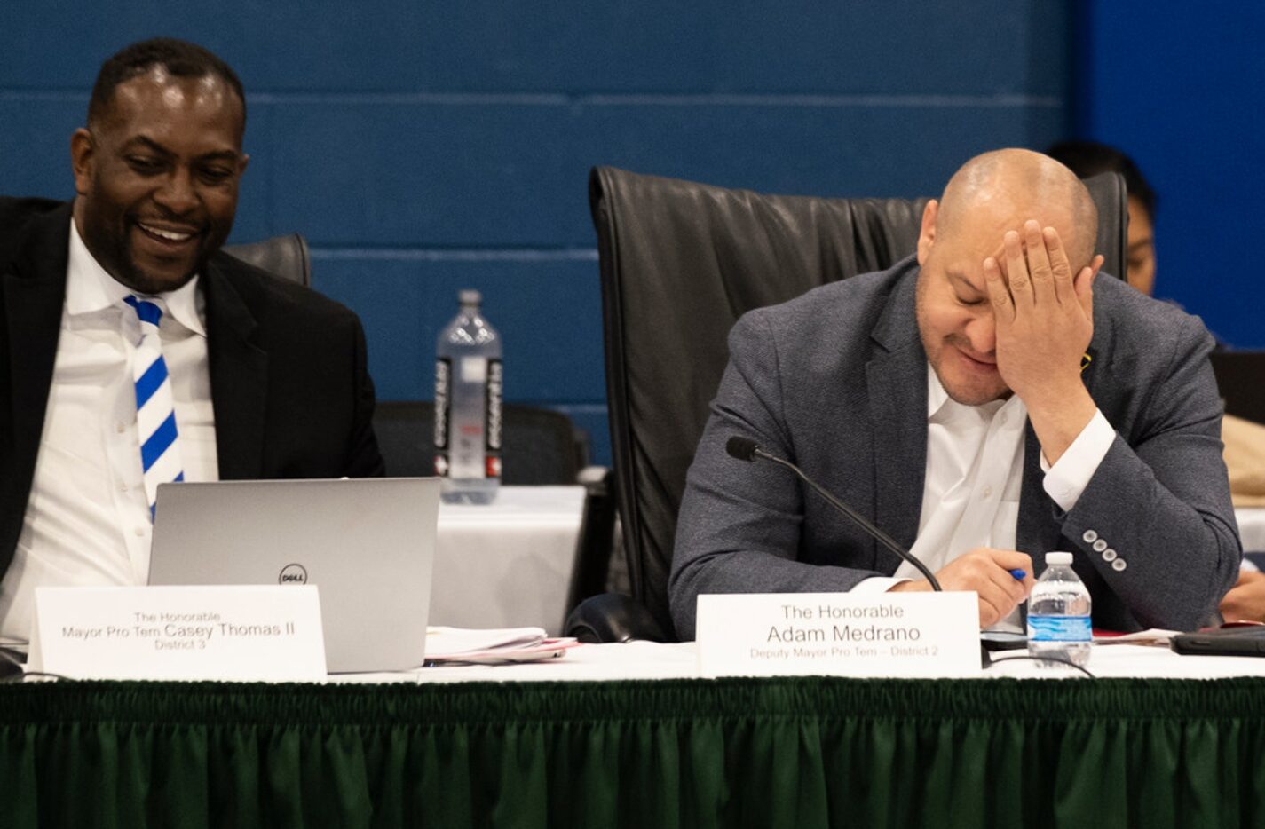 Dallas City Council Deputy Mayor Pro Tem Adam Medrano rubs his face as Mayor Pro Tem Casey...