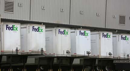 Trailers are unloaded at the FedEx Ground Dallas Hub in Hutchins on Thursday. (Louis...