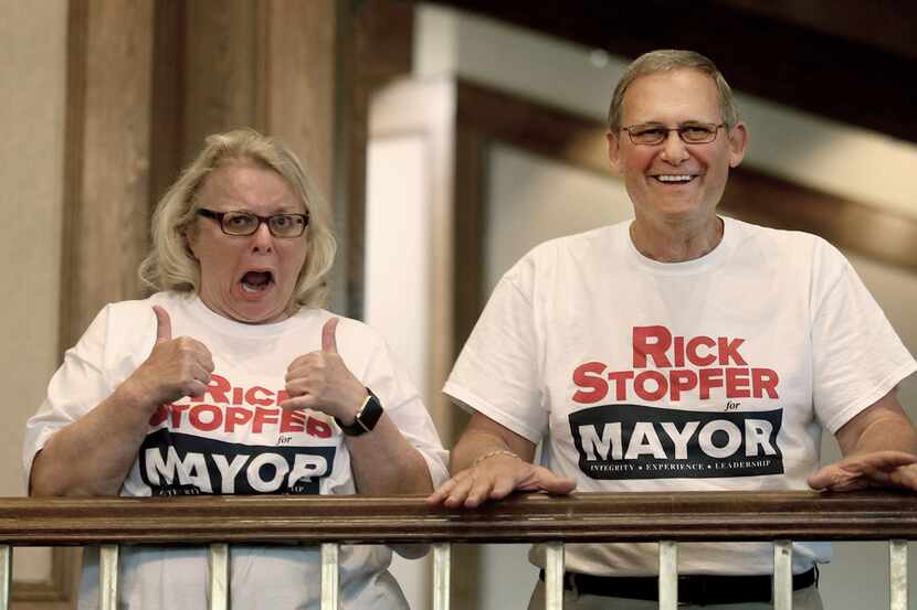 Irving Mayoral candidate Rick Stopfer, with his excited wife Melanie, gives the thumbs up,...