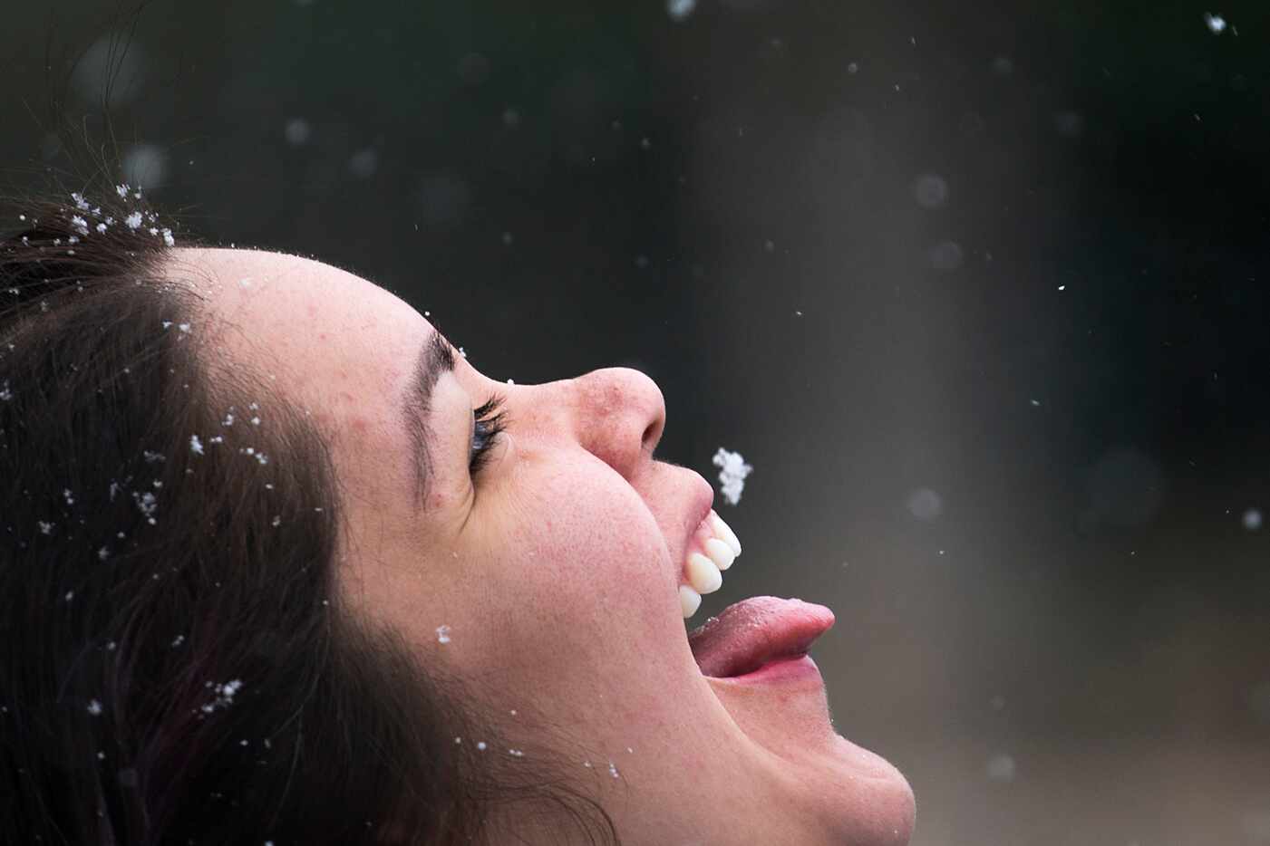 Racene Mendoza stepped outside her job at a bakery to try to catch snowflakes as snow fell...