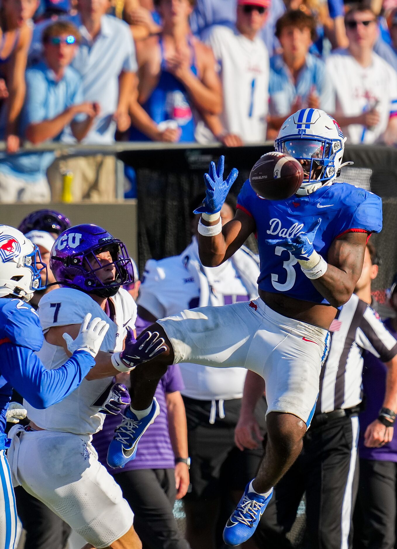 SMU safety Ahmaad Moses (3) intercepts a pass intended for TCU wide receiver JP Richardson...