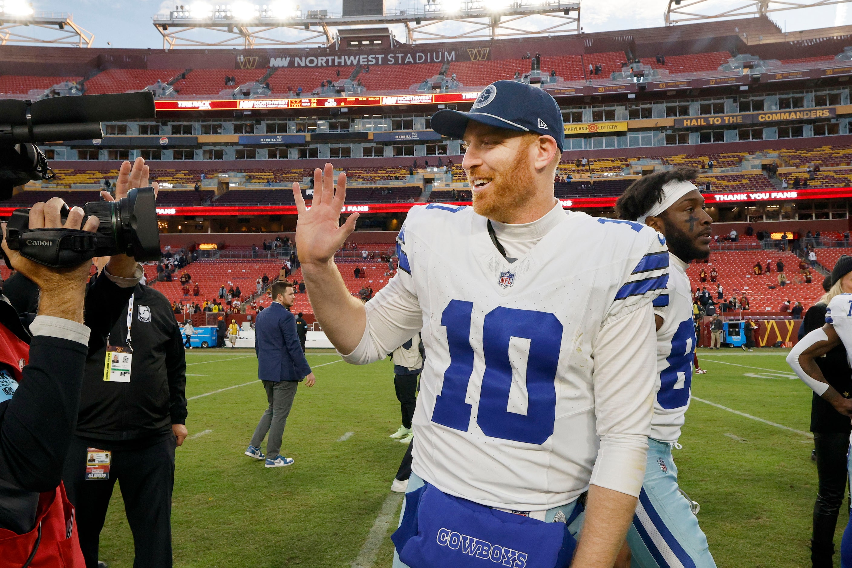 Dallas Cowboys quarterback Cooper Rush (10) waves to camera when he leaves the field after...