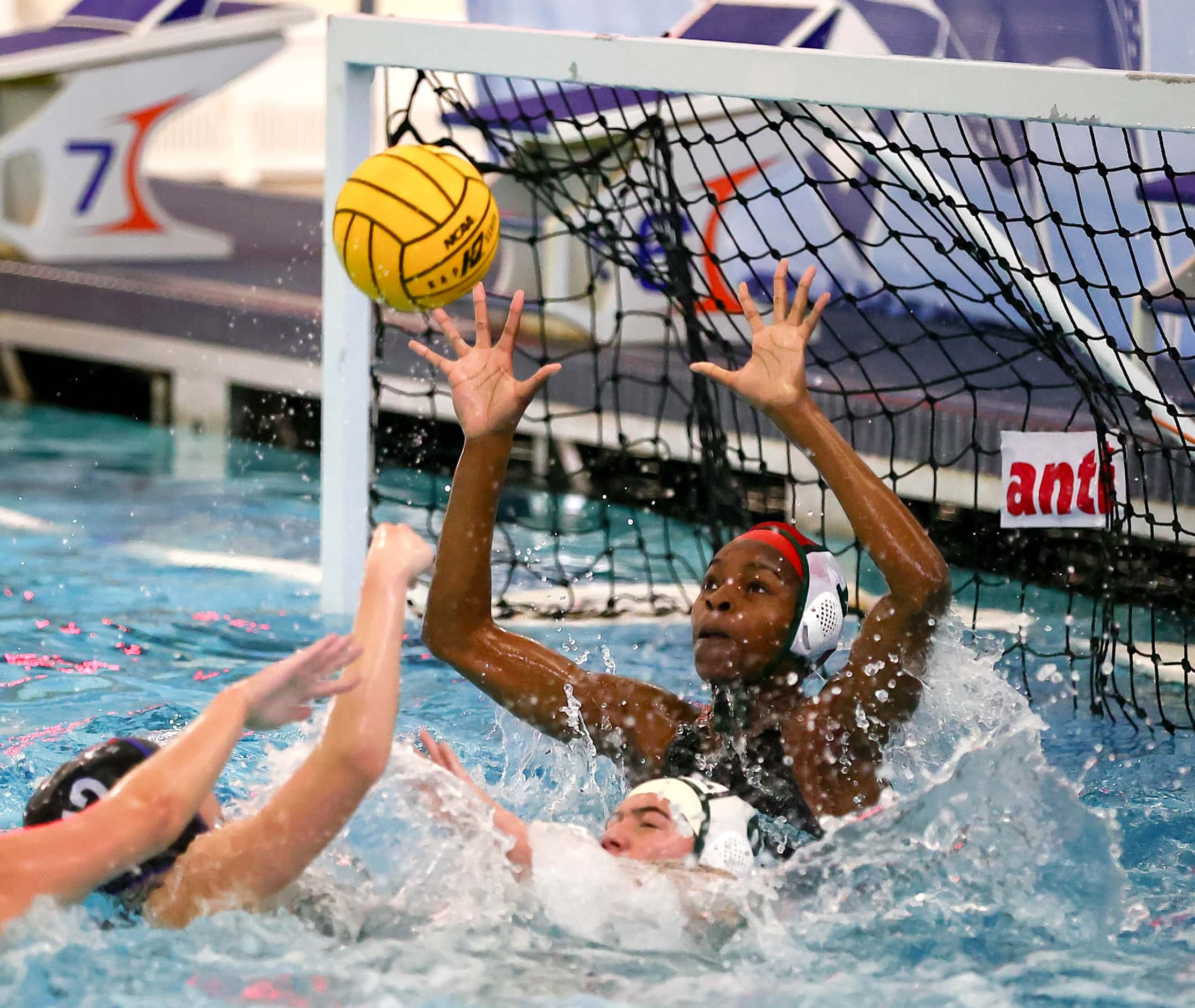 Southlake Carroll goal keeper Somto Okafo goes for a save on the ball against Hebron in the...