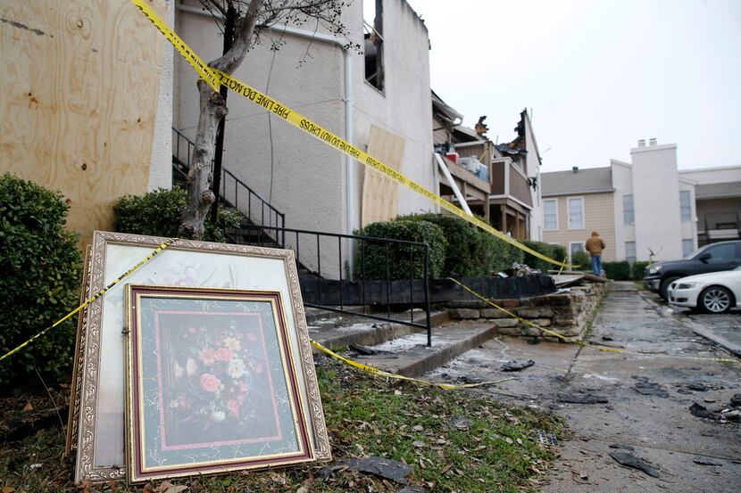 Artwork sits outside of an apartment unit after a fire damaged eight units at Del Rey...