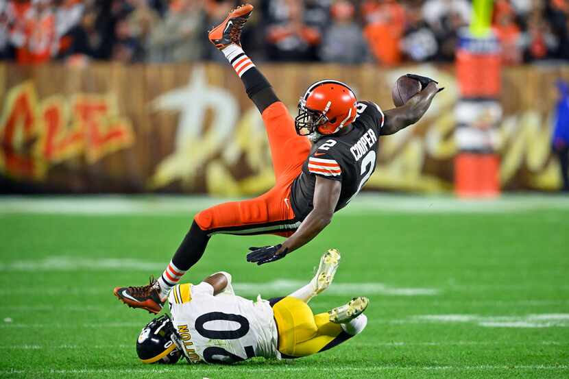 Cleveland Browns wide receiver Amari Cooper (2) is upended by Pittsburgh Steelers cornerback...