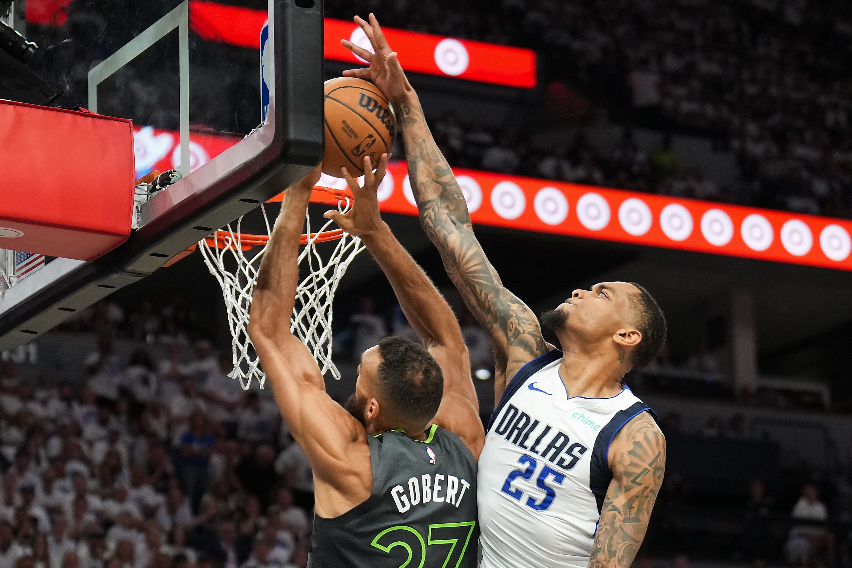 Dallas Mavericks forward P.J. Washington (25) blocks a shot by Minnesota Timberwolves center...