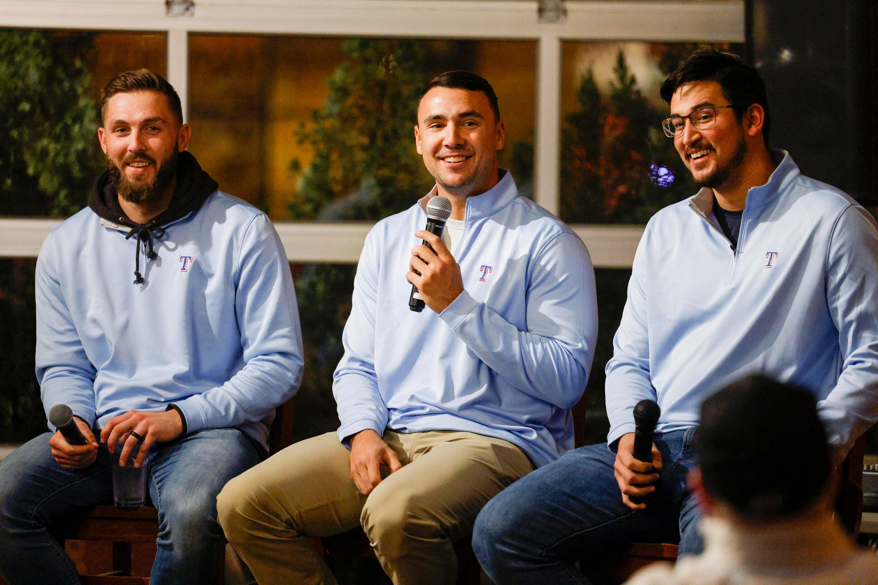 From left, Texas Rangers pitchers Joe Barlow, Brock Burke and Dane Dunning participate in a...