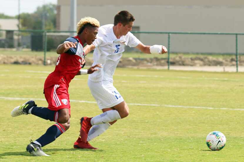 Conner Lewis (#15 white) of Solar SC defends against Malik Henry-Scott of FC Dallas. (9-22-19)