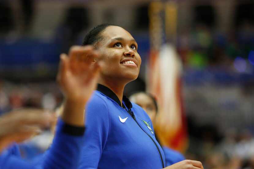 Dallas Wings forward Azura Stevens (30) beams as she watches a teammate score during team...