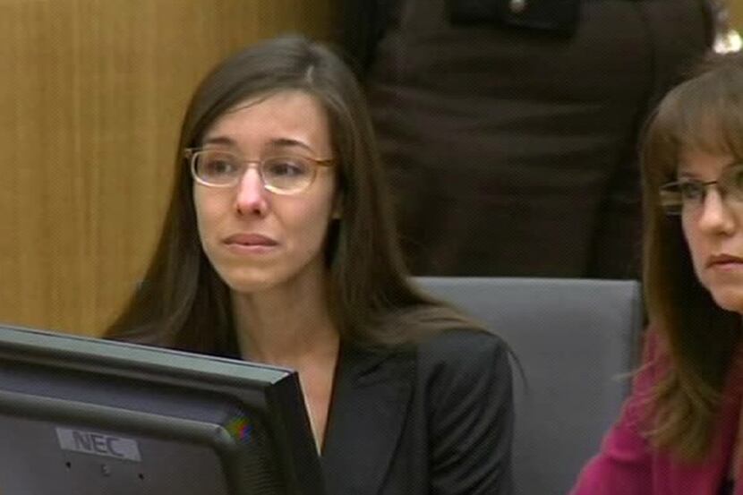 In this image made from pool video provided by APTN, murder defendant Jodi Arias reacts...